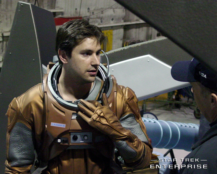 Evan English in an EV Suit between takes on the set of 