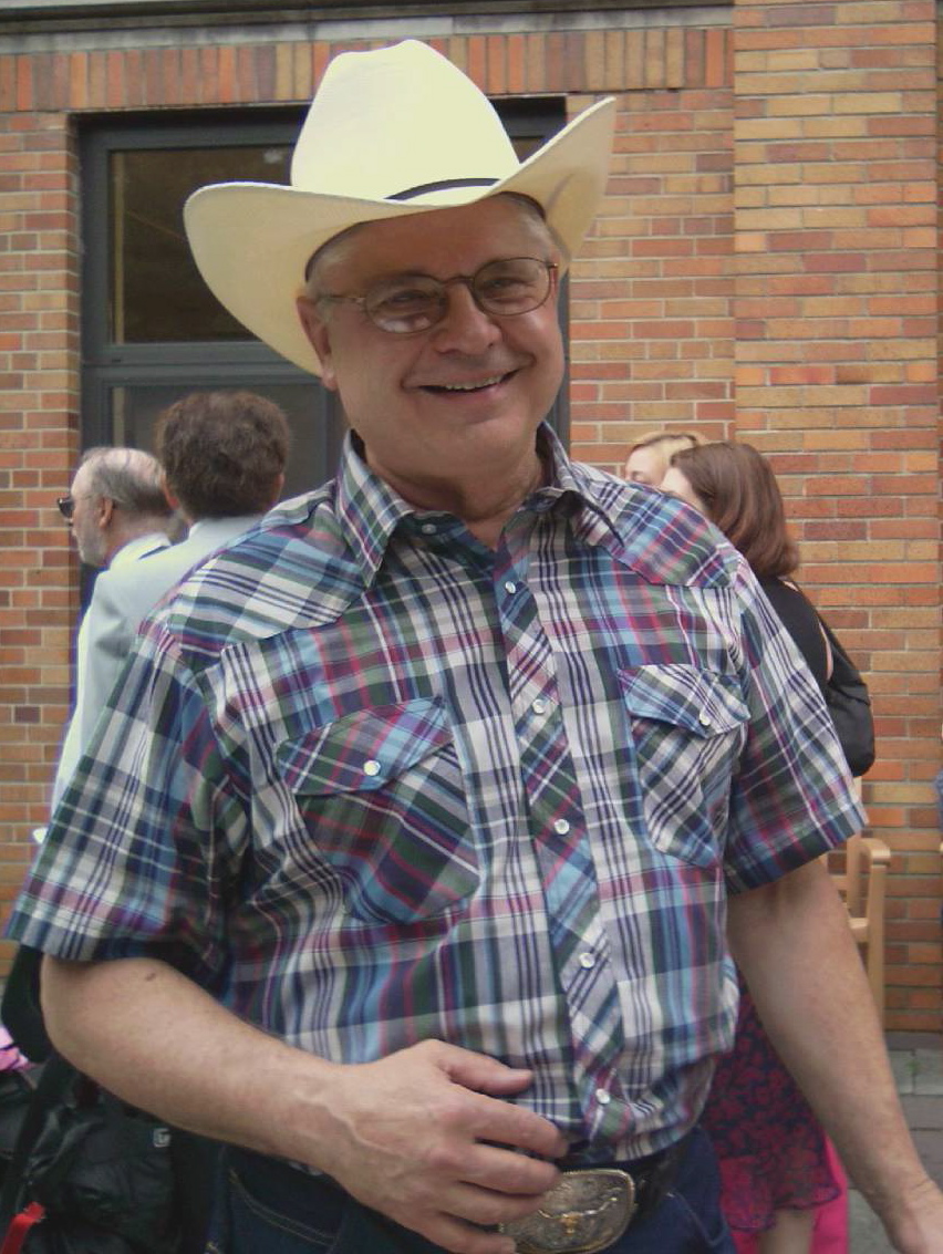 Logan Fry as Rancher at Funeral (