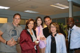 Emily Rae on set filming Private Practice with Kate Walsh, Paul Adelstein, Taye Diggs, and director Donna Deitch.