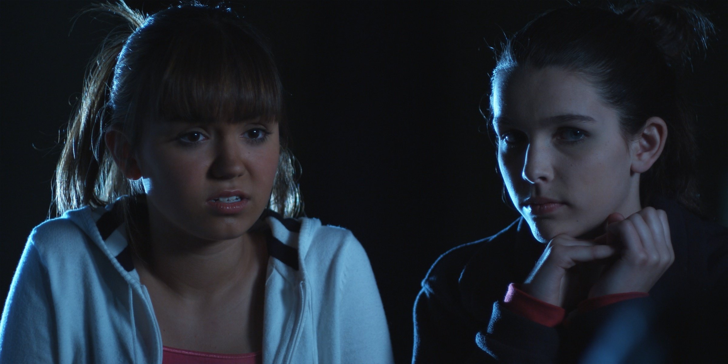 Celeste (Celeste Kellogg) and Becca (Amanda Waters) in the abandon theater at night. From 