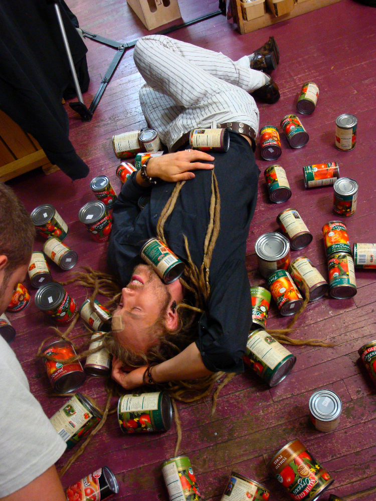 Azmyth Kaminski crushed from the tower of falling cans stunt in The Cost Of Living