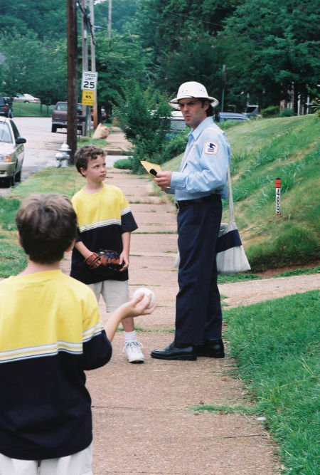 Greg Thompson (in postal uniform) in a scene from POSTAL.