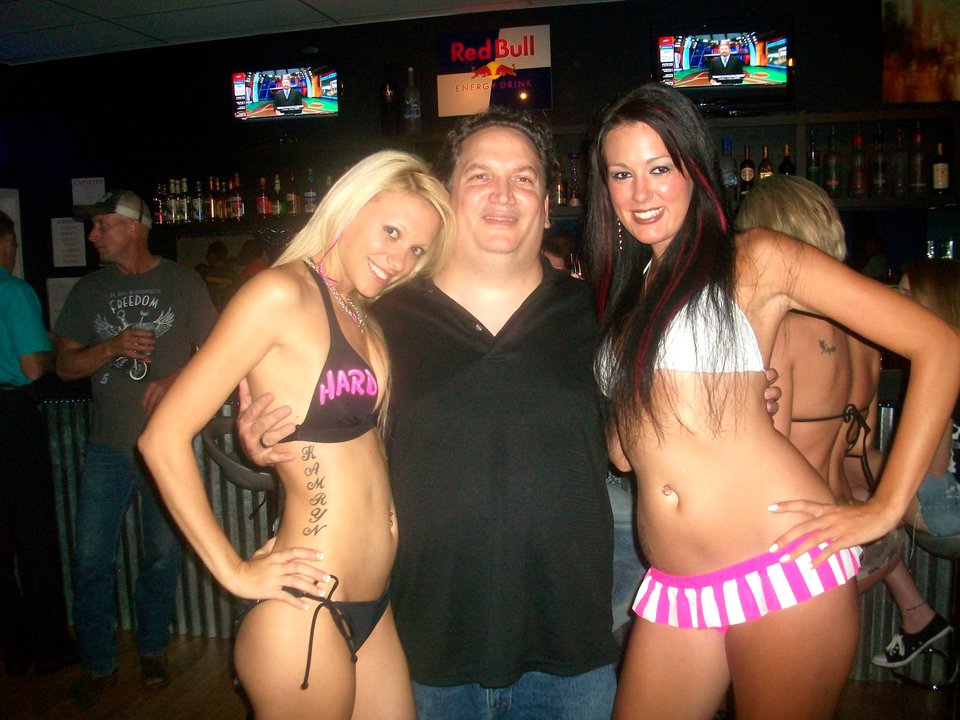 James Magnum Cook with Magnum's Models Team Models Kristian Lee and Emily Harris at the Fluid Night Club in Bowling Green, Kentucky. The Models were there competing in a Ring Girl Competition for Hard Rock Mixed Martial Arts!