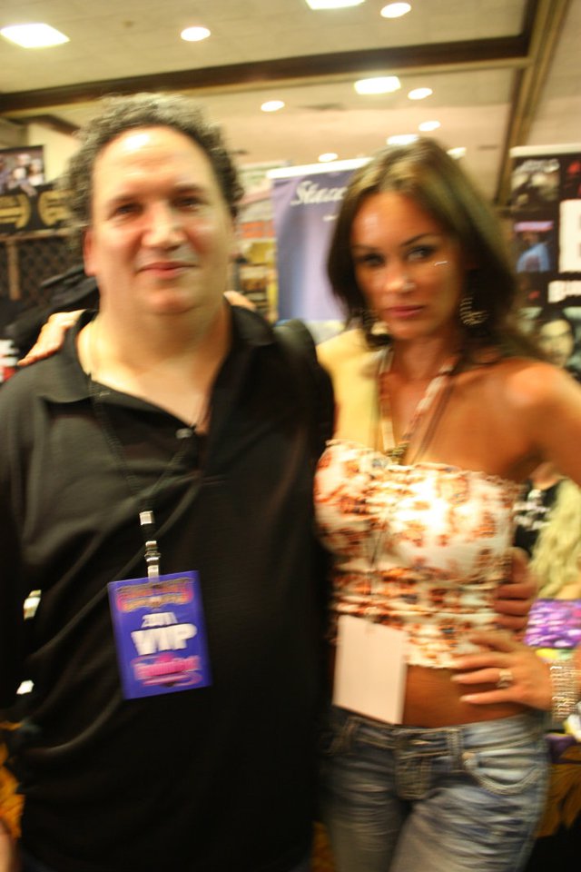 James Magnum Cook with Actress/Model Stacey Dixon at Fright Night/Fandom Night 2011 in Louisville, KY. (Sorry about the reflection as the camera hit the lights wrong)