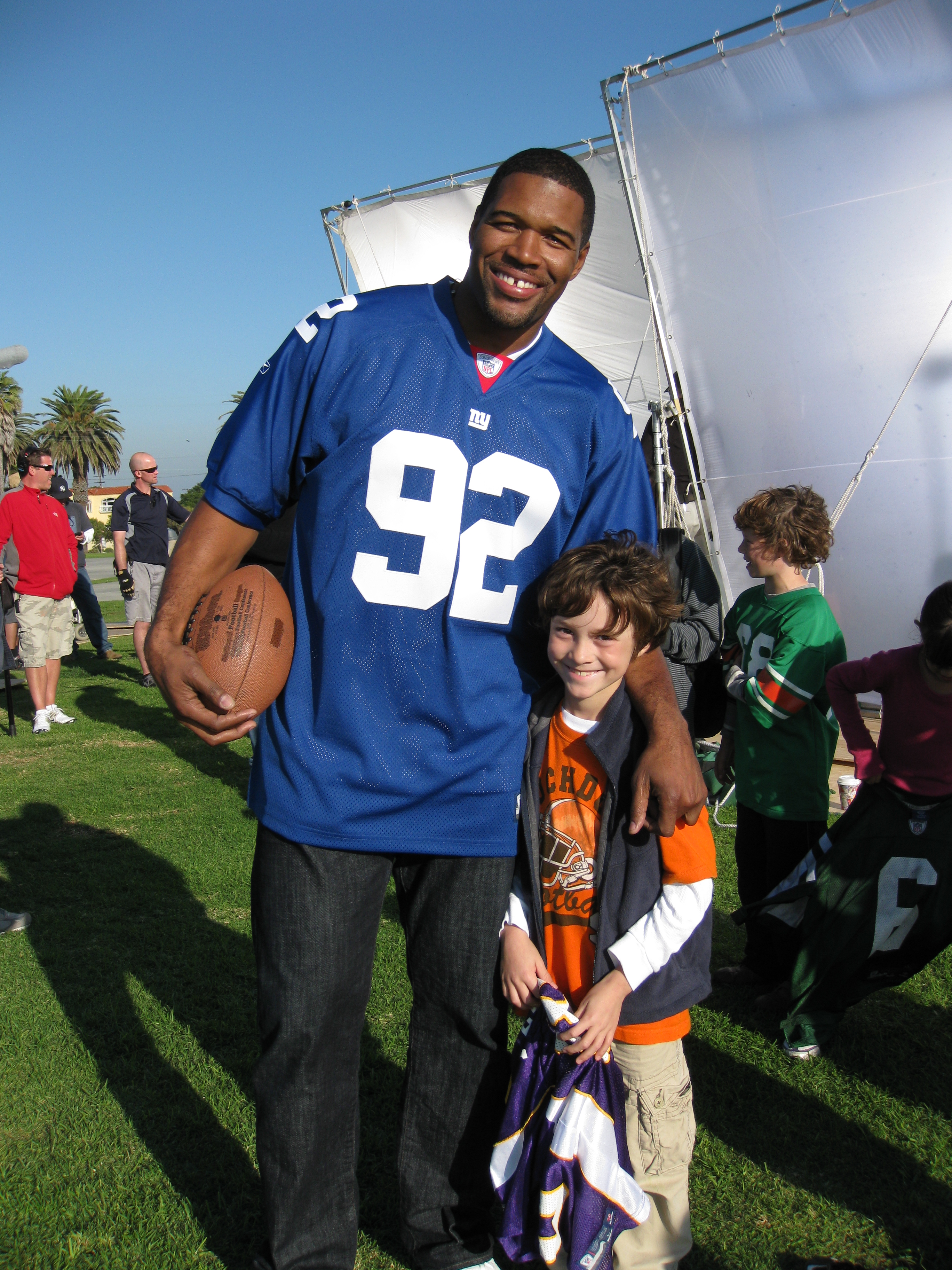 Griffin Cleveland with Michael Strahan on the set of Sports Authority - NFL Play 60 spot.