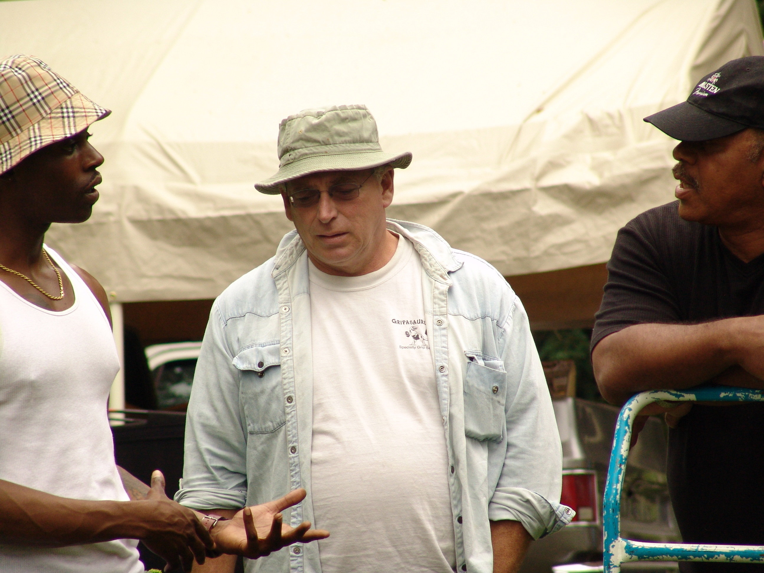 Shane Dean giving direction to Garry Chalk and Nathaniel Deveaux on the set of Under The Sycamore Tree.