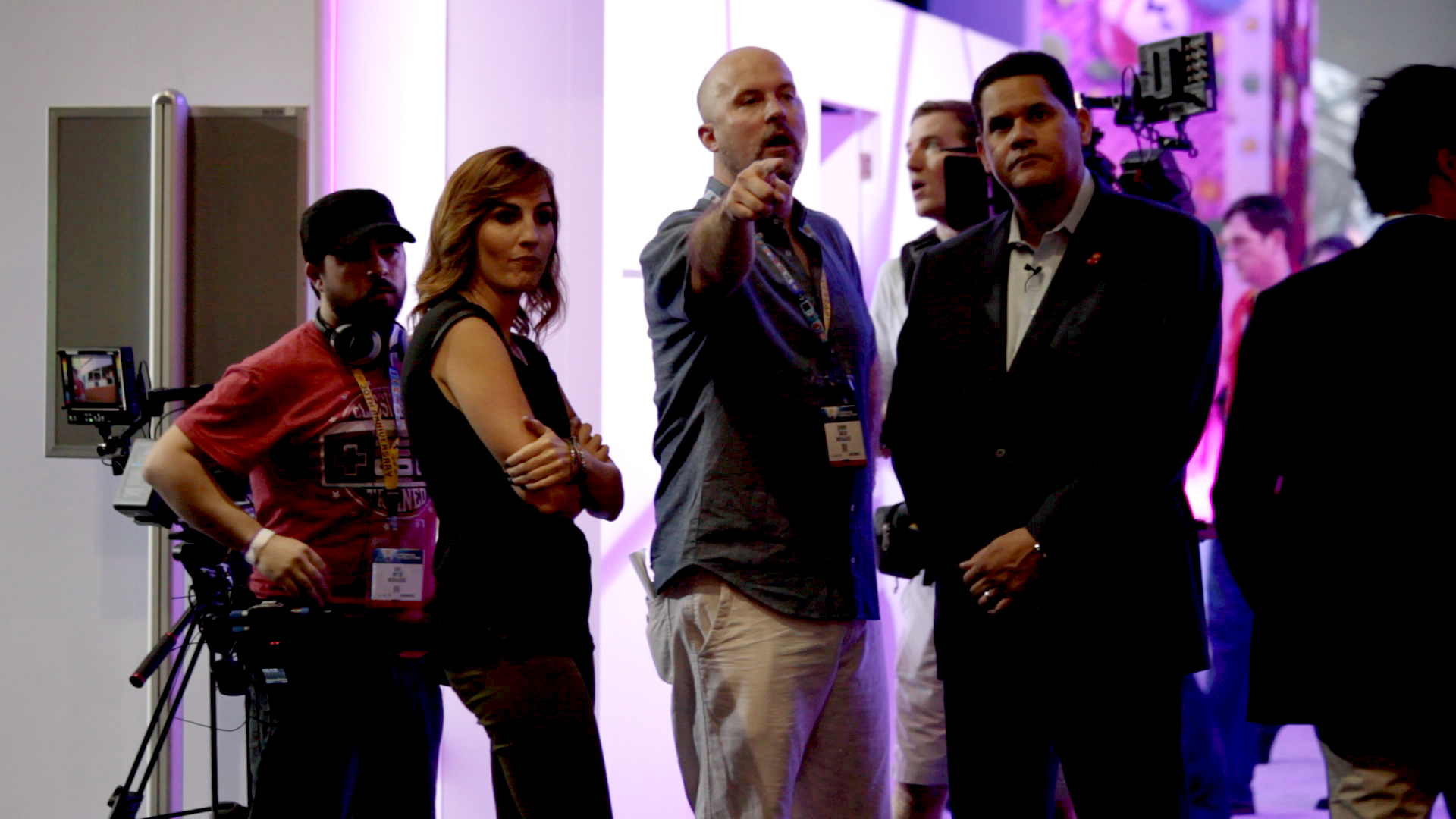 Jeremy Snead with host Alison Haislip taking Nintendo CEO Reggie Fils-Aimee through shots at E3 2015.