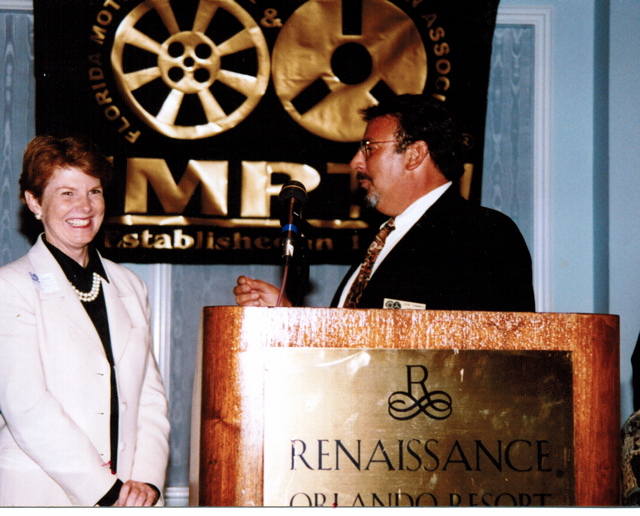 Cummings presents award as State President of FL Motion Picture and Television Assoc.