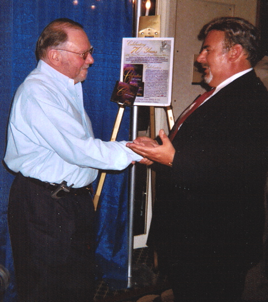 Cummings receiving award