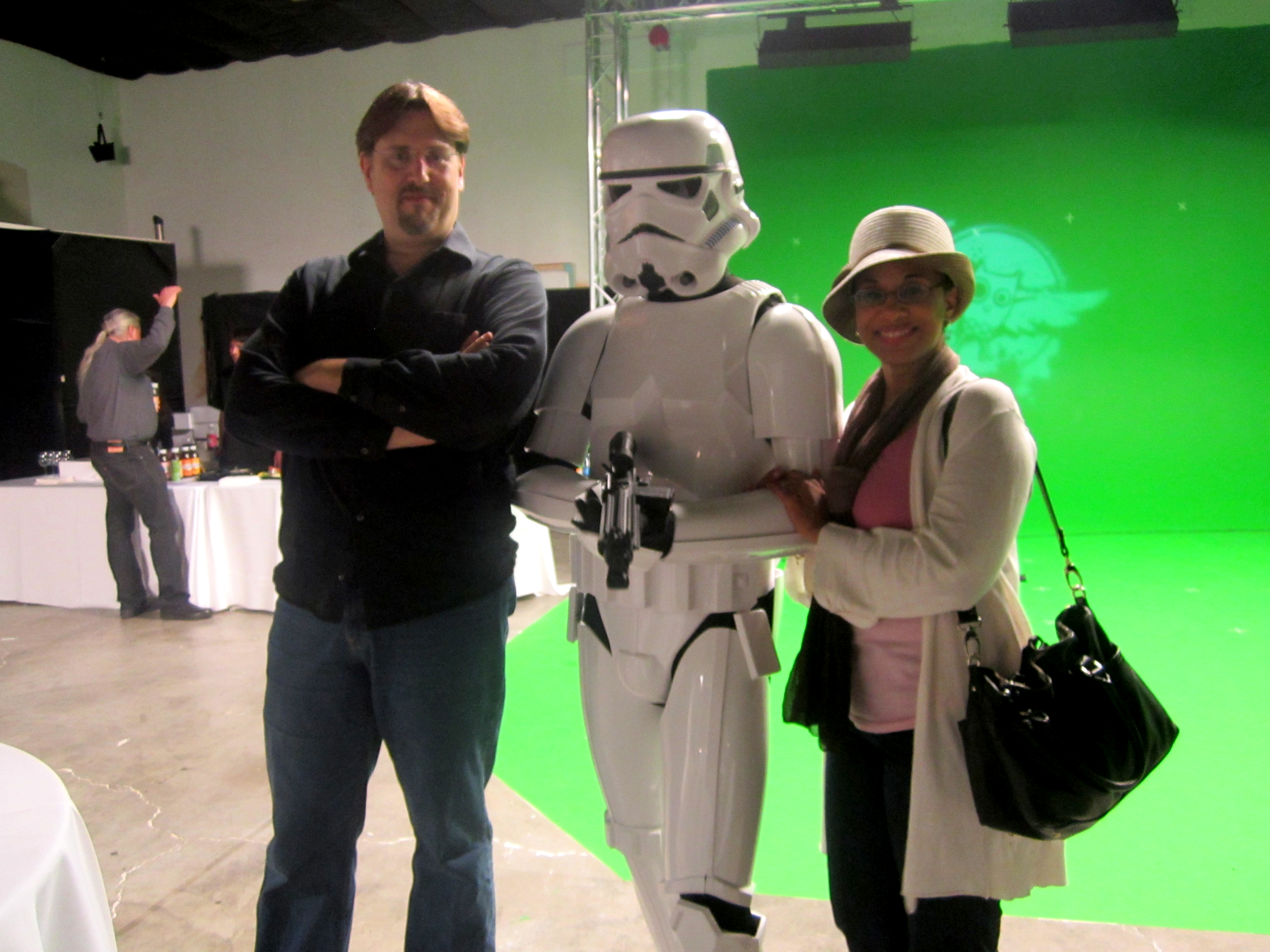 Veronica Loud and her husband C. Andrew Nelson pose with a stormtrooper on the greenscreen stage at the grand opening of Athena Studios in Emeryville, CA.