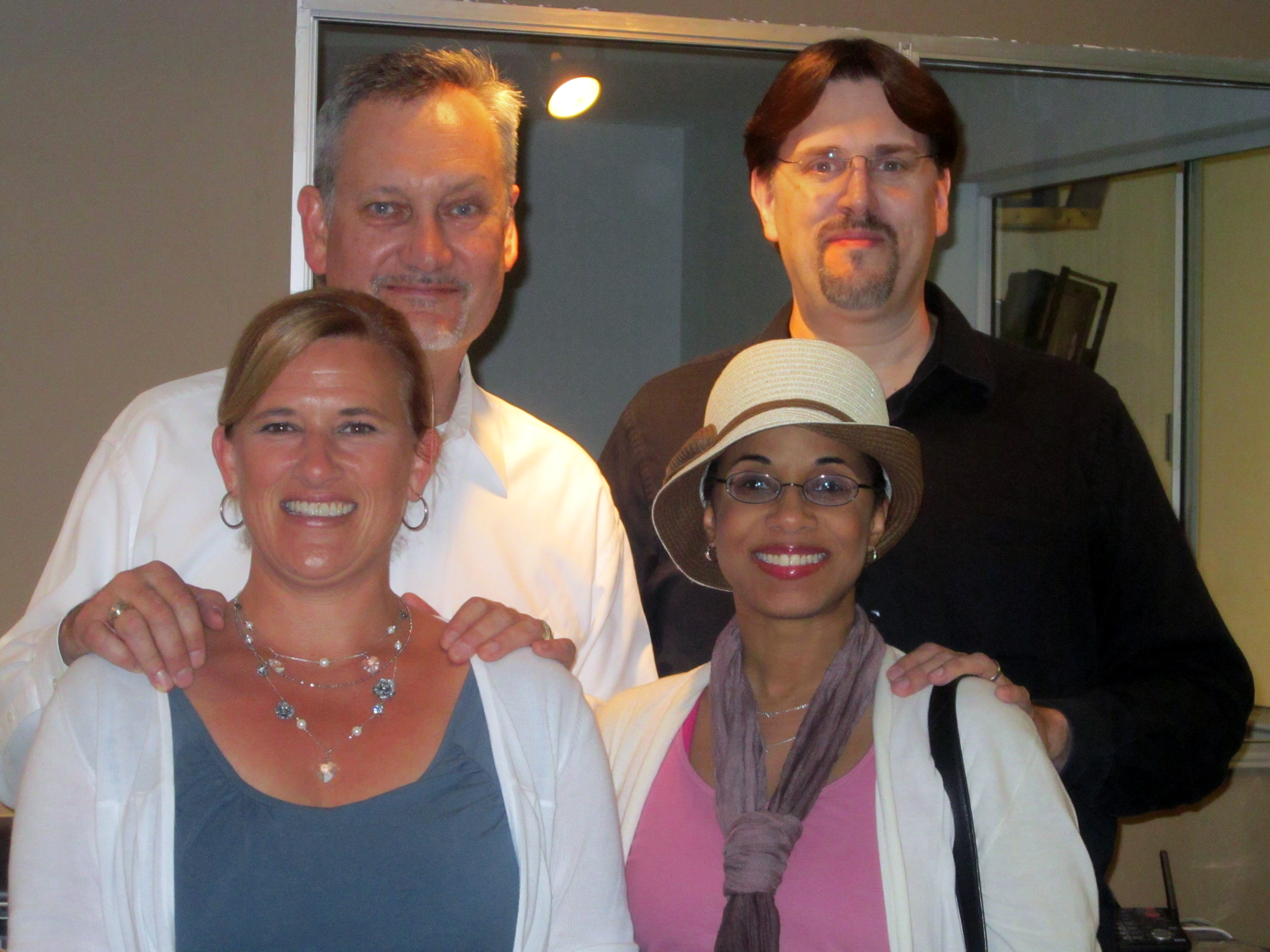 Veronica Loud and her husband C. Andrew Nelson (right) with Jon Peters (left) and his wife at the grand opening of Peters' post-production facility Athena Studios in Emeryville, CA.