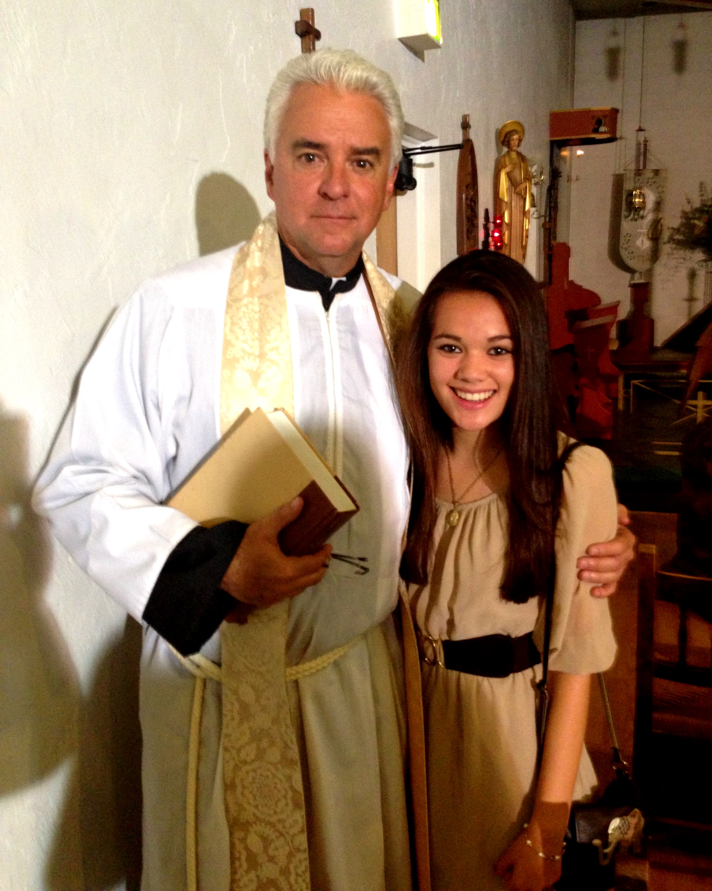 Christine Mascolo with John O'Hurley, as Father David, on the set of 