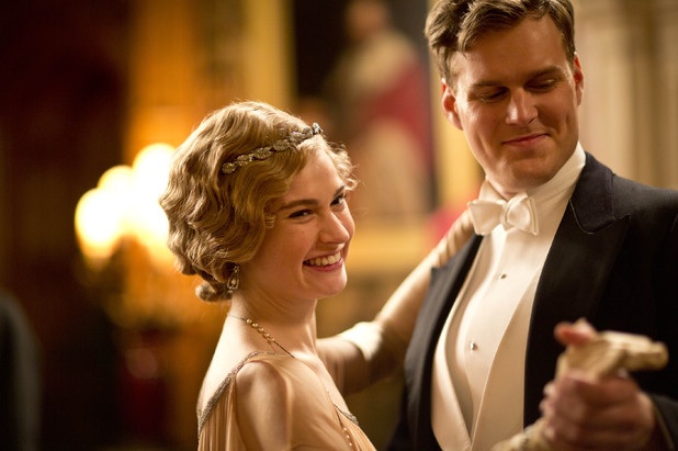 Still of Lily James and Andrew Alexander in Downton Abbey