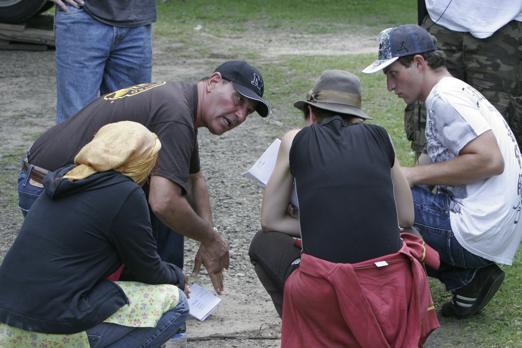 Monica Surrena (center) works with stunt coordinator Justin DeRosa to maximize the impact of the motorcycle race. Also in the photo are Sarah Zerina Usmen (left) and Ryan DeQuintal.