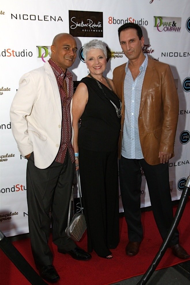 Jesus M. Villanueva, Dolores M. Lombardi and Roberto Lombardi on the red carpet.