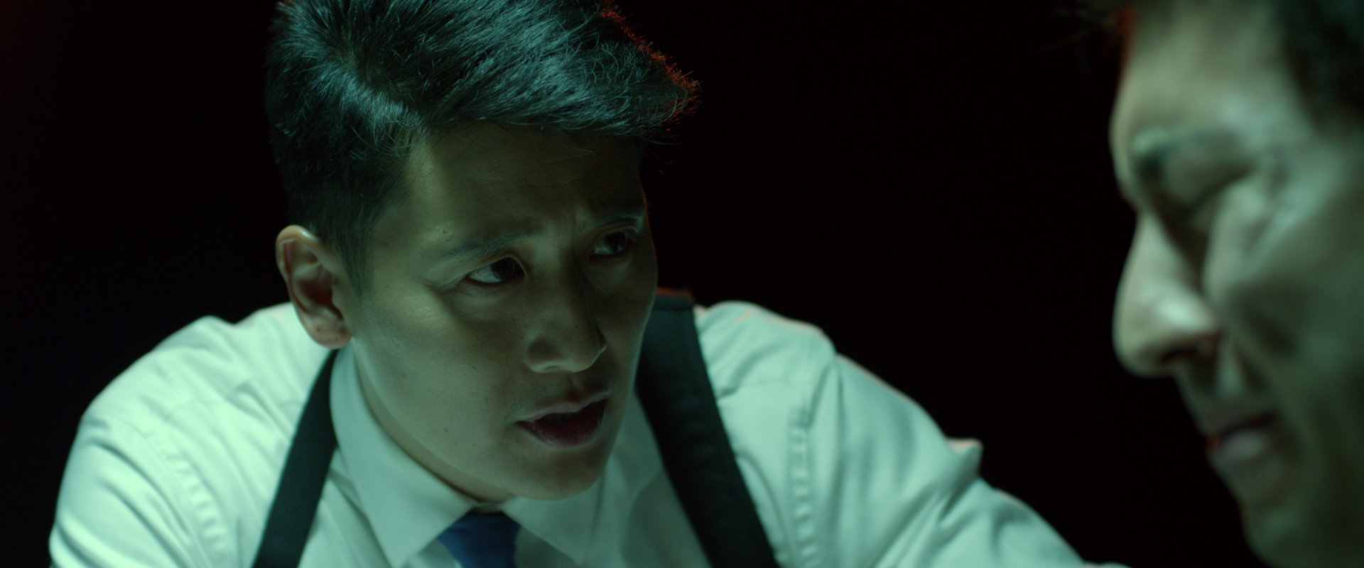 Detective Salem Chow (Gordon G. Lee) shakes down Twitchy (Nicholas Corralez)