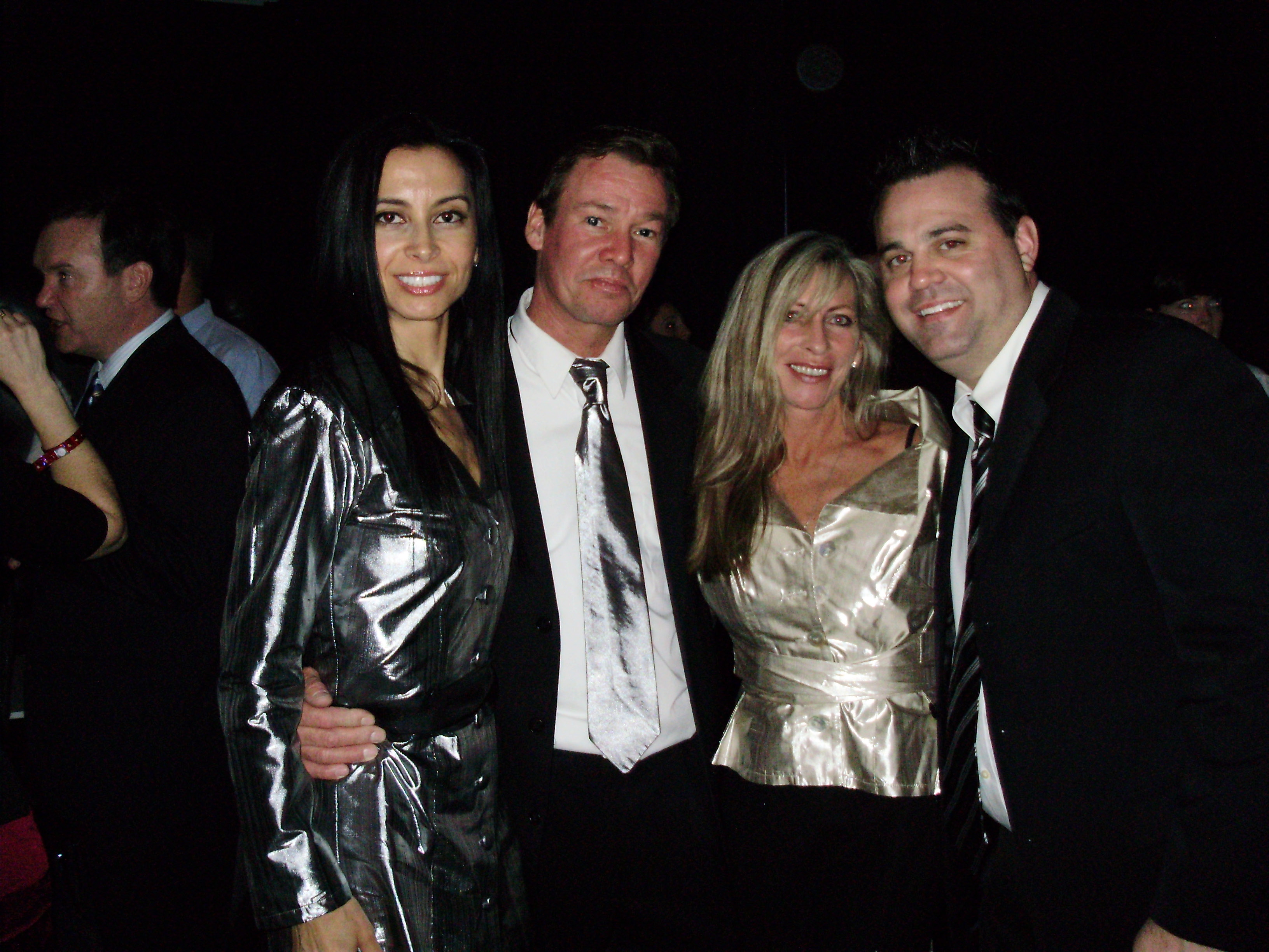 Jennifer Gjulameti, Arthur Wahlberg, Susan Darian, and Chuck Slavin. (Women's outfits by KAREN WARREN. Matching Silver Metalic tie by 2-HIP.) THE FIGHTER.