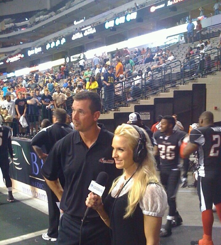 Erin Marie Garrett sideline reporter for Time Warner Cable Sports broadcast of AFL Dallas Vigilantes game.