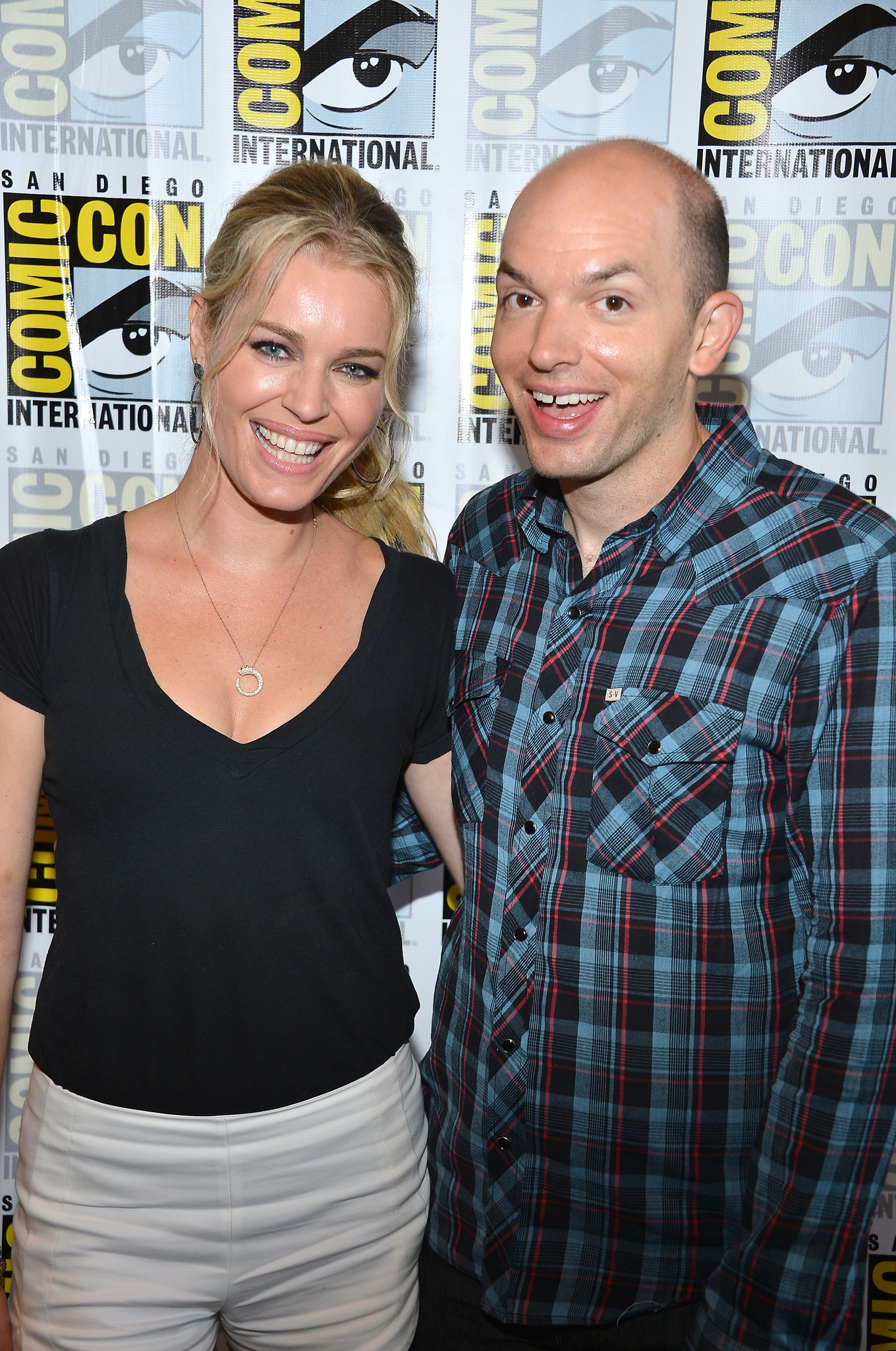 Rebecca Romijn and Paul Scheer at event of NTSF:SD:SUV (2011)