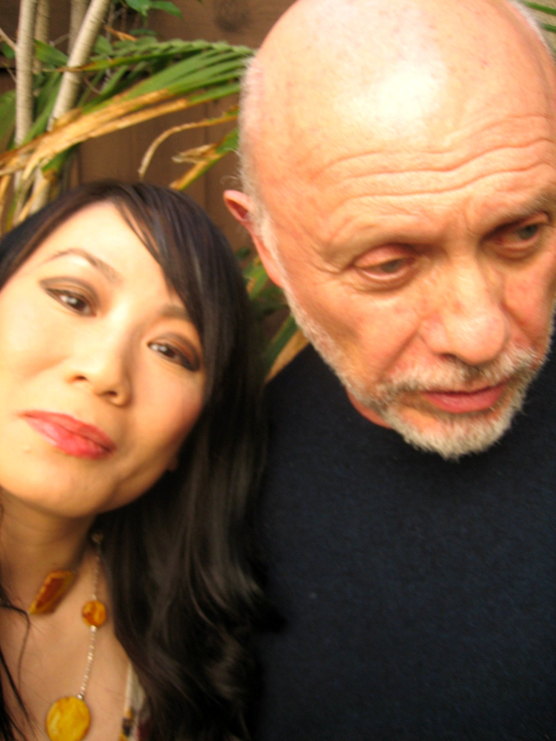 Linda Wang and Hector Elizondo posing for the Chinese associate news press article.