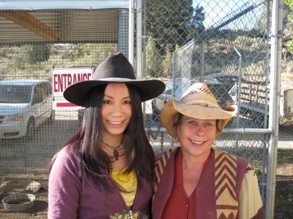 Linda Wang working with wild Bull trainer on Discovery channel's hit show -- Animal Planet.