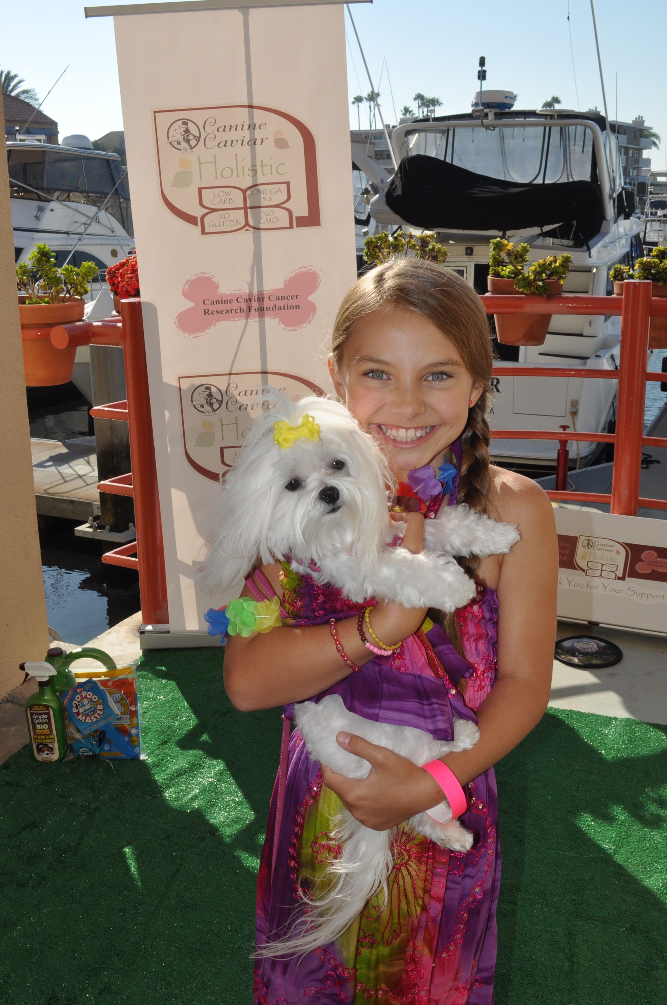 Caitlin Carmichael and Tallulah attend a charity fundraiser benefiting the Canine Caviar Cancer Research Foundation 2013