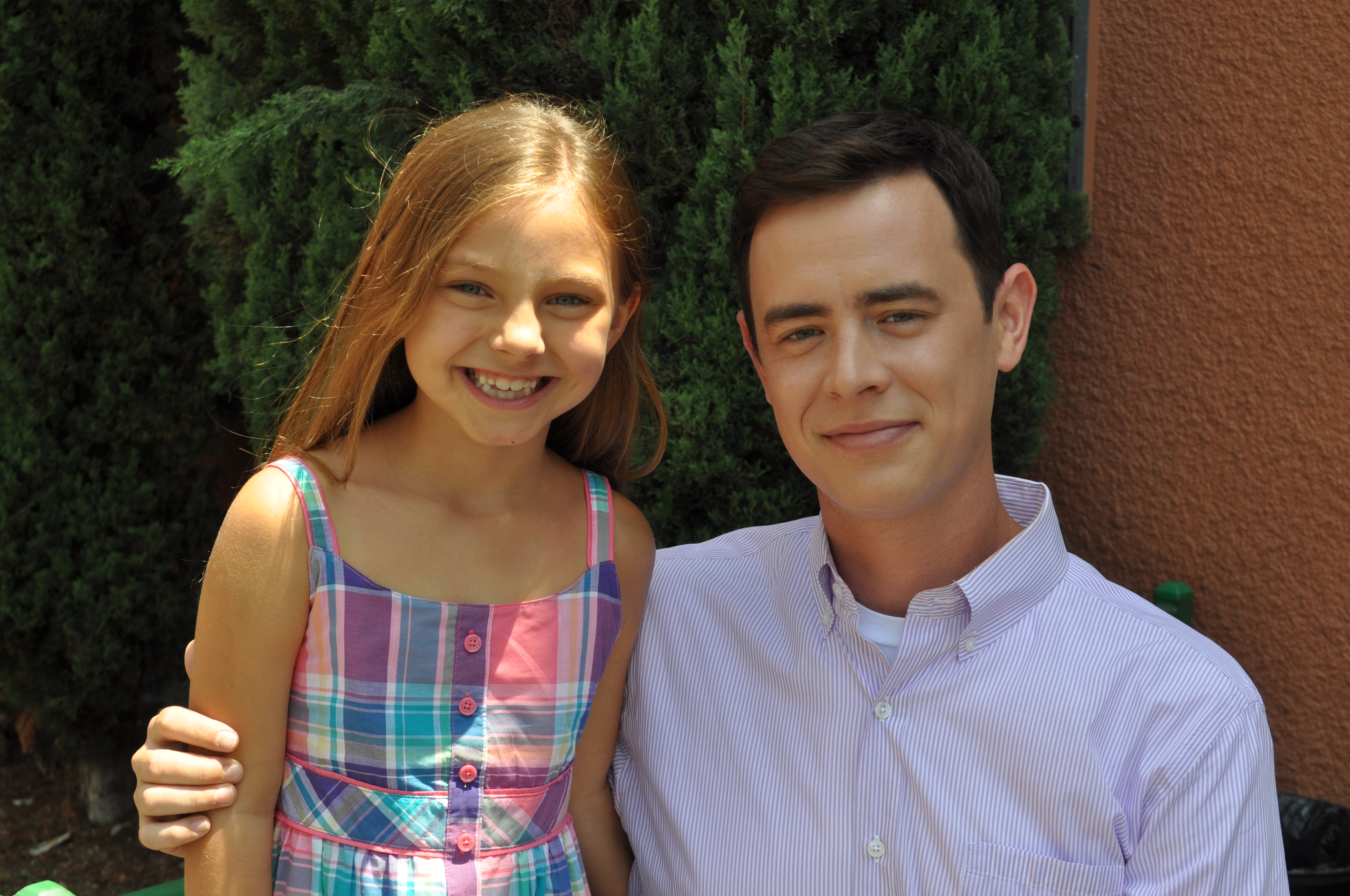 Caitlin Carmichael and Colin Hanks on the set of 