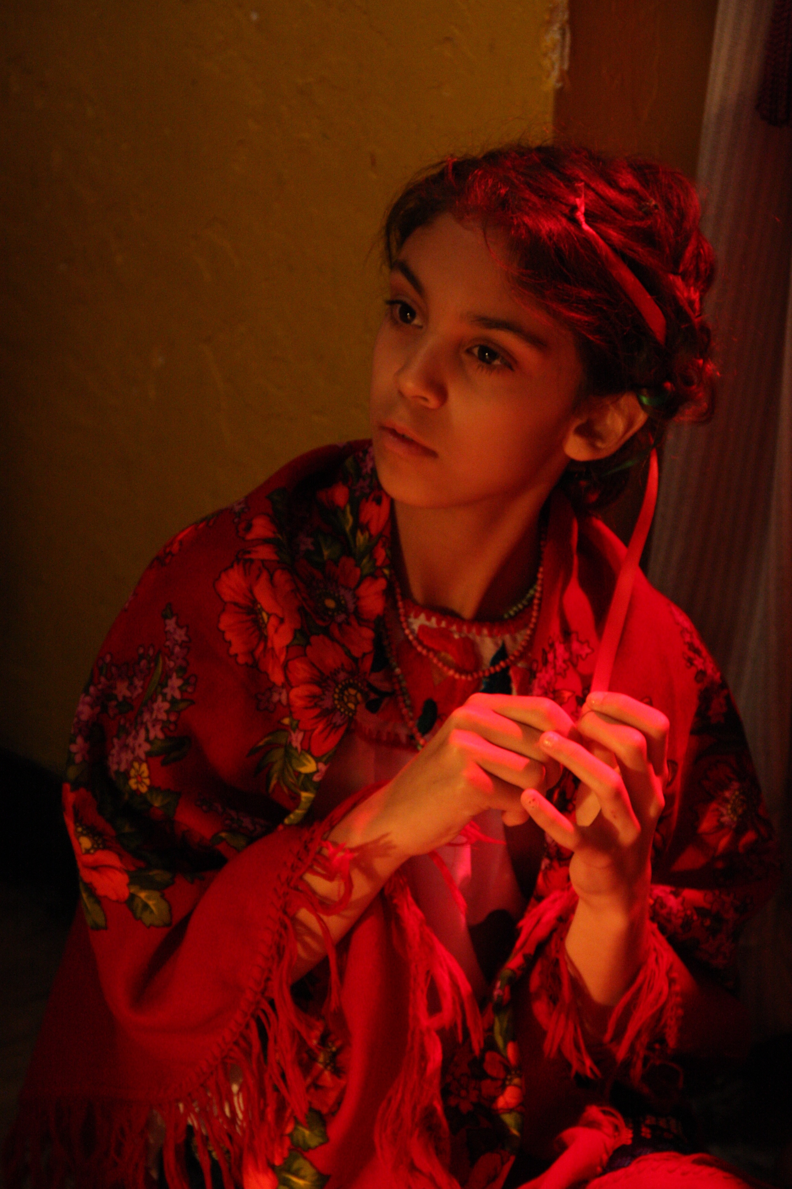 Anne Marie playing the role of a mournful, indigneous Mexican girl, 