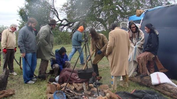 Cast and Crew members prepare for a scene during a cold day on set.