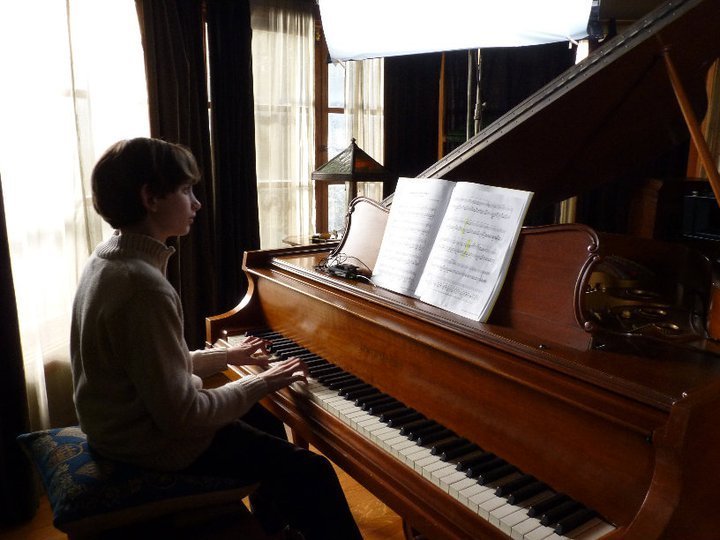 Henry, a 12-year-old piano prodigy, practices the Chopin 