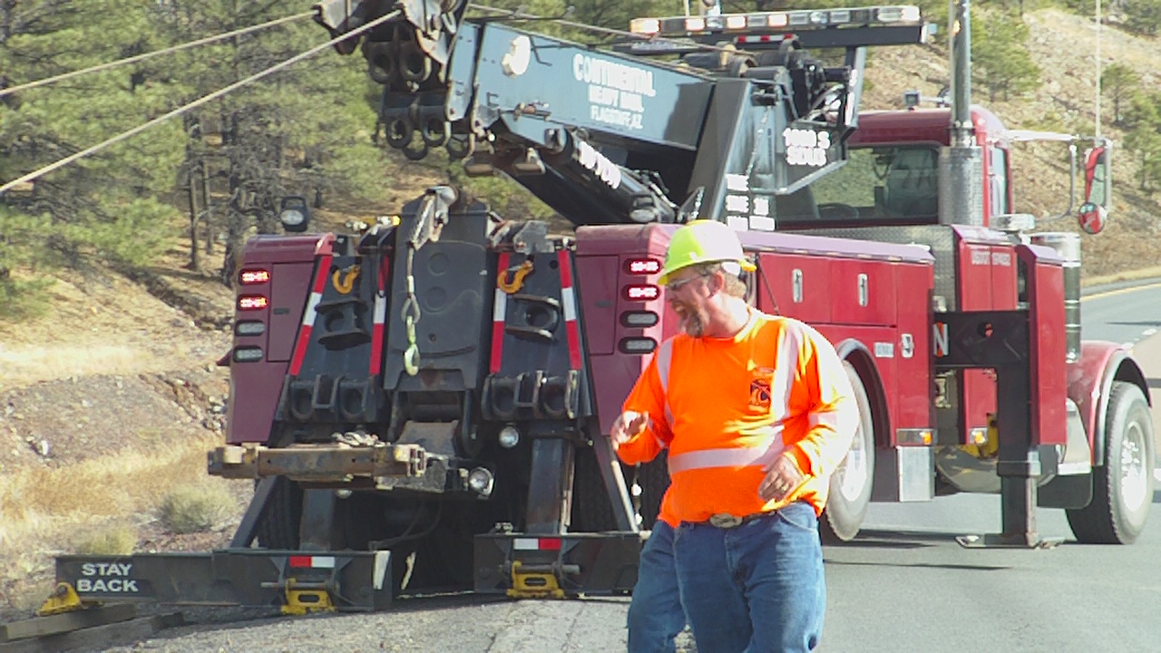 Crew hauling a semi out of a valley off I-40 near Flagstaff, AZ