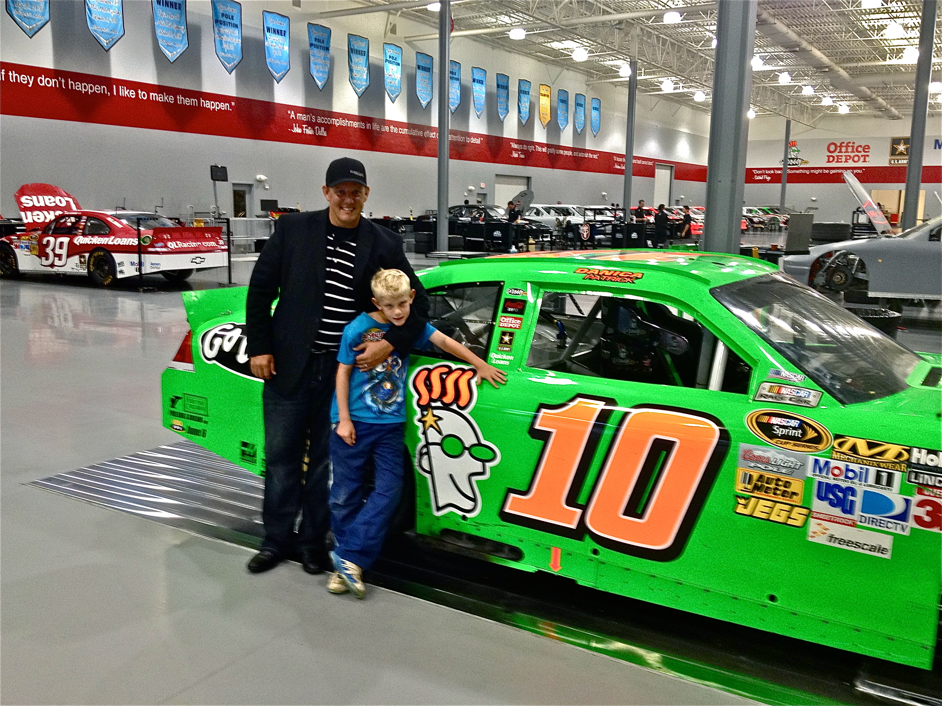 Christopher Morrow with his son Hudson discussing sponsorship opportunities with Stewart-Haas Racing.