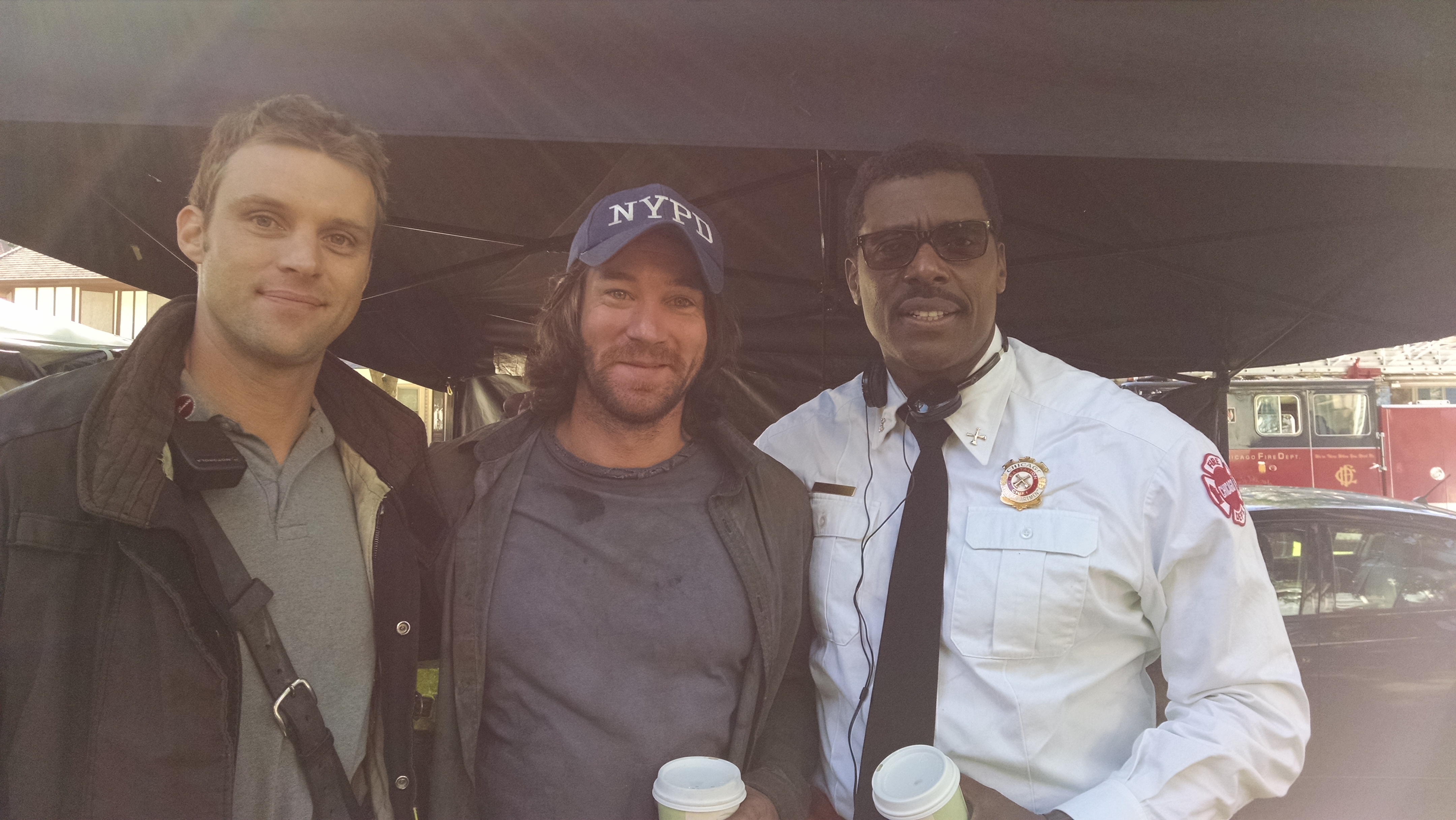 Ryan Carr and actors Eamonn Walker and Jesse Spencer on the set of Chicago Fire