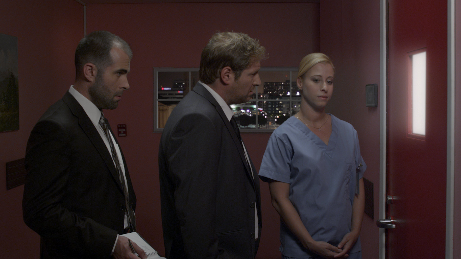 Nurse Becky briefs detectives Sherman and Snyder. Art Hall as Dt. Snyder, Jayson Gladstone as Dt. Sherman and Lara Starr Rigores as Nurse Becky in 