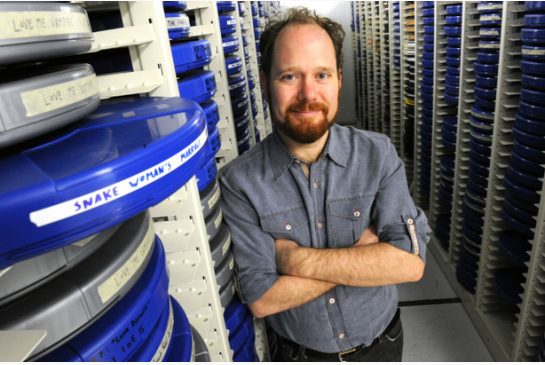 Colin Geddes, prominent local film aficionado and historian, visits his old friends -- hundreds of Hong Kong films --at the U of T, where he donated them for students' benefit.