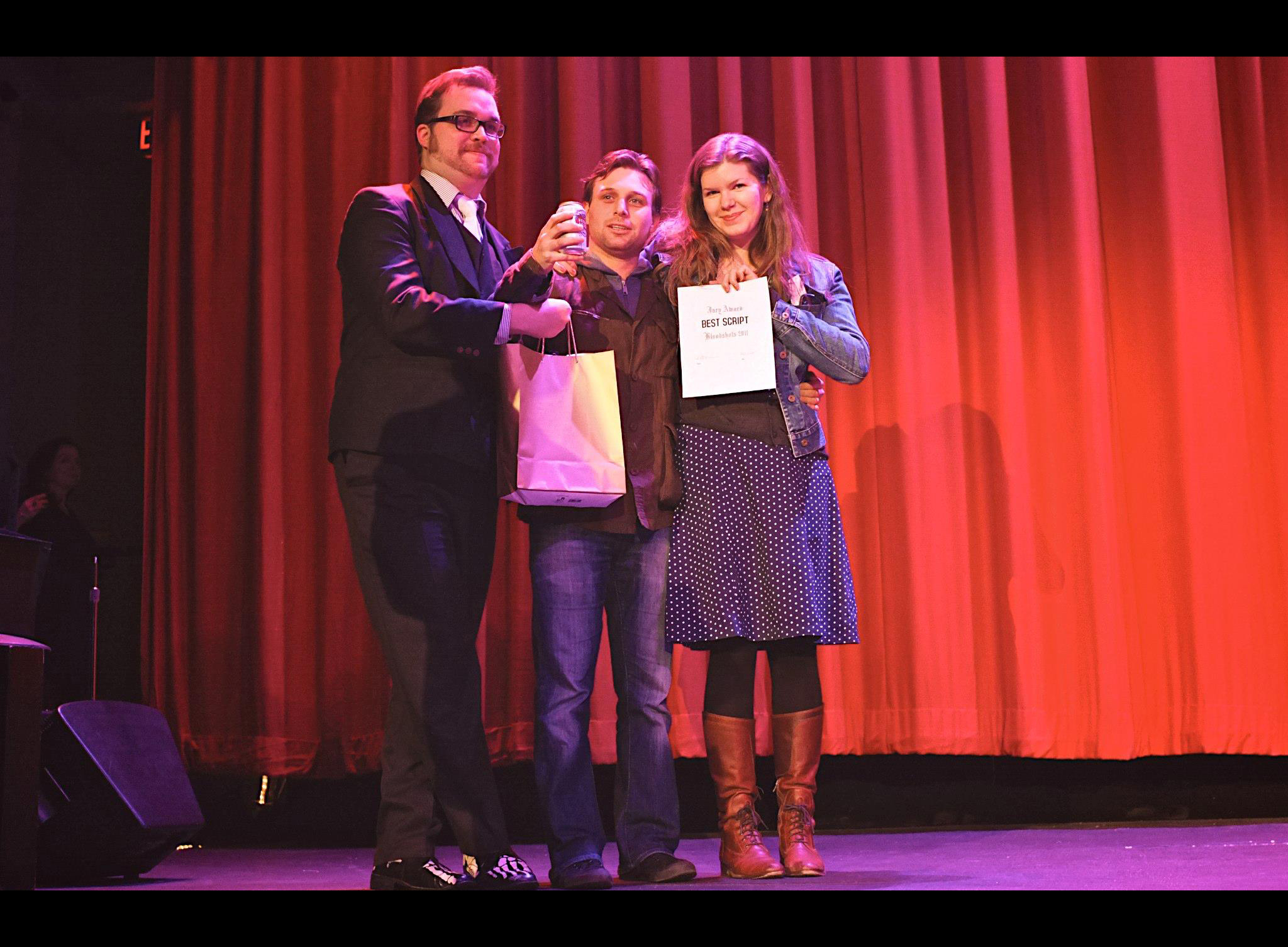 Conor Gomez (middle) with Nancy Shaw and Tyler James Nichol accepting the Award for 'Best Script' at the 2011 Bloodshots Film Festival. Photo taken at the historic Rio Theater in Vancouver, BC.