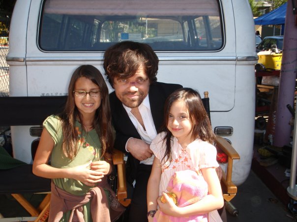 Yasmine with fellow actress sister Trinity and actor Peter Dinklage on set of 