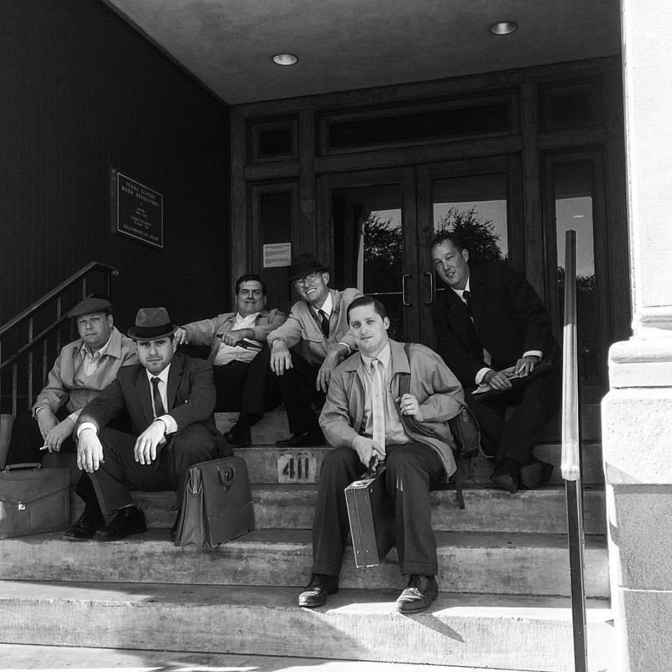 Relaxing on set of 11.22.63. Sitting on steps of Texas School Book Depository.