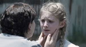 Willow Shields and Jennifer Lawrence in The Hunger Games