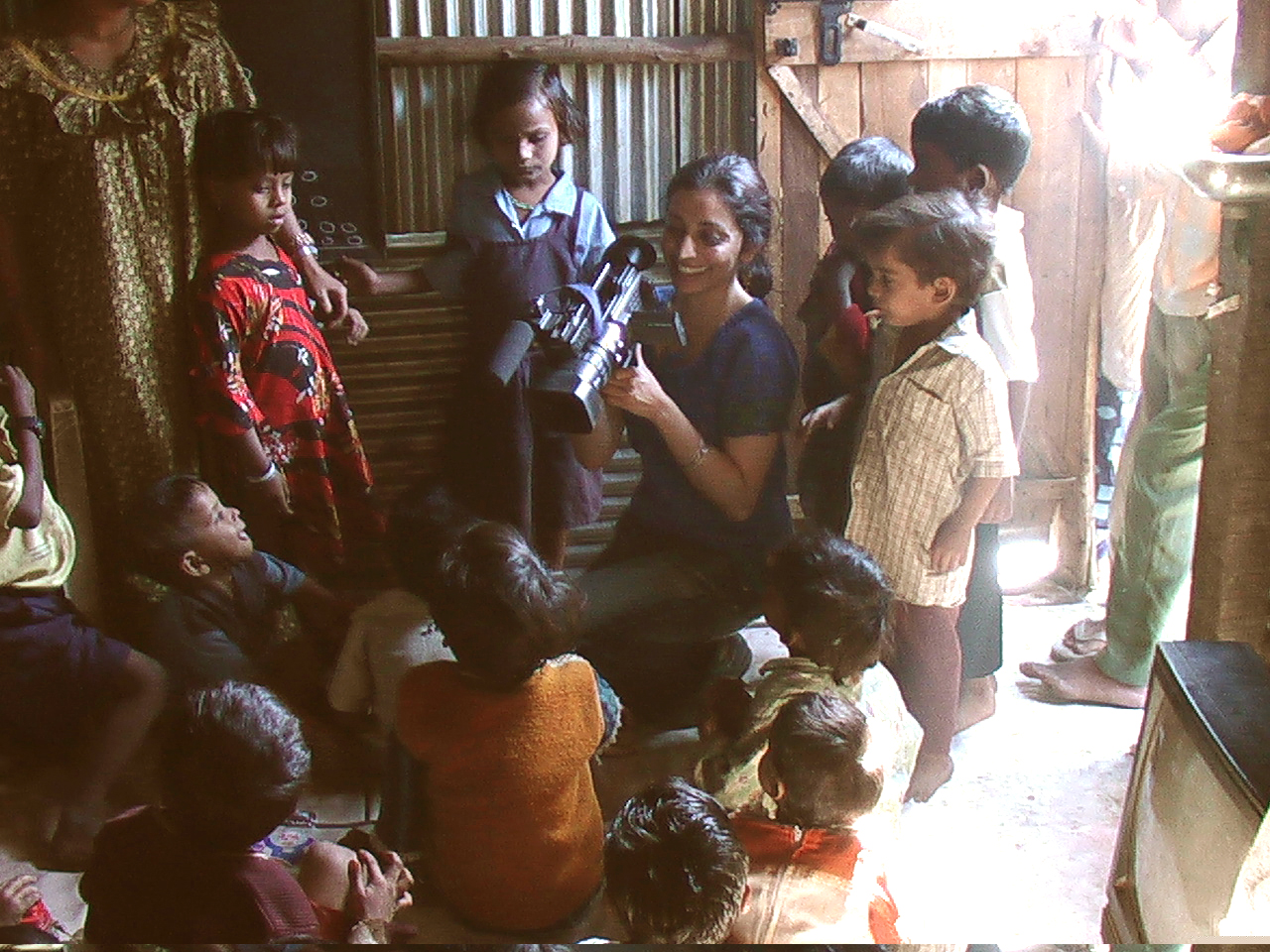 Ana Tiwary filming in Mumbai slum school.