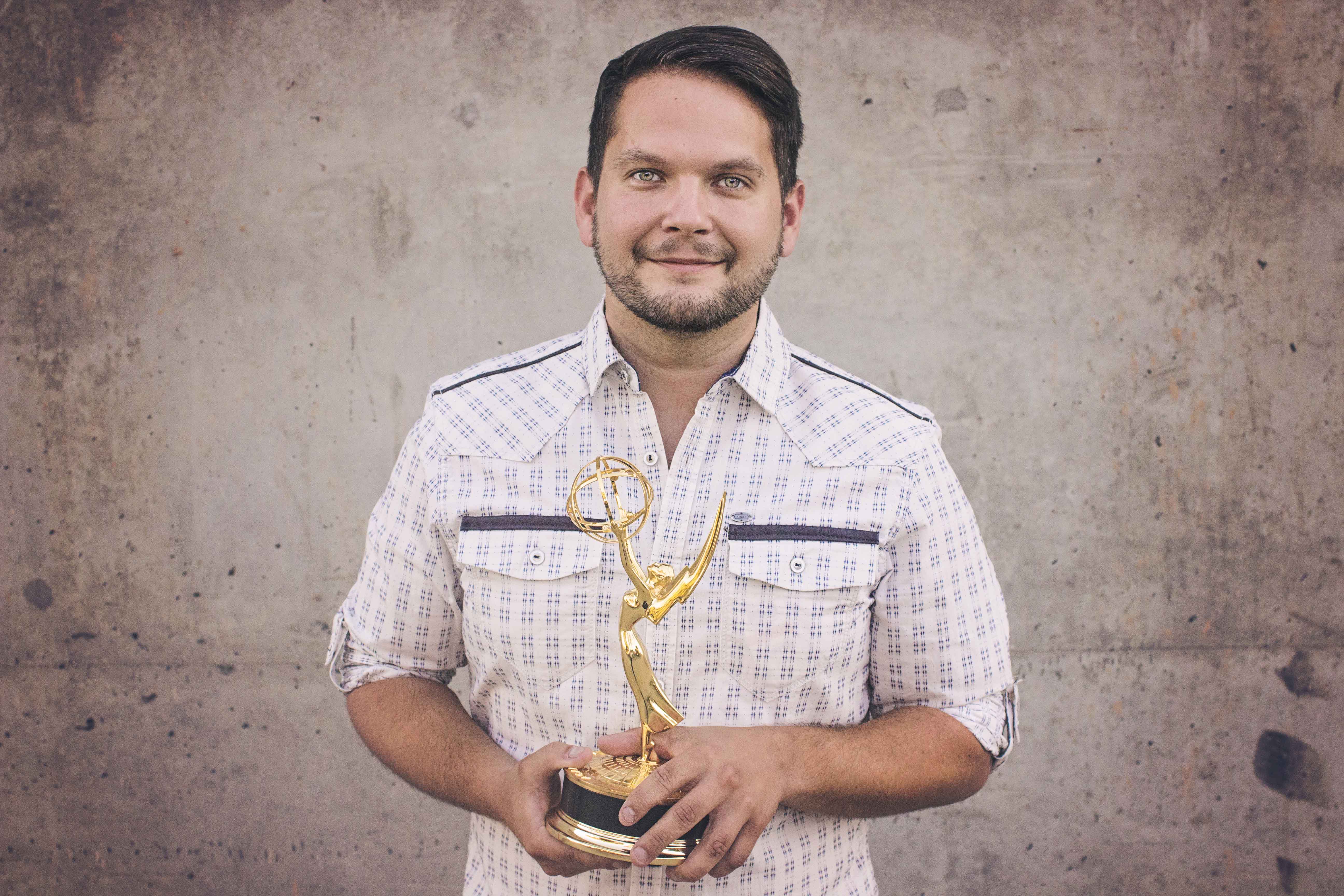 Evan with is Emmy Award from the 67th Annual Los Angeles Regional Emmys.