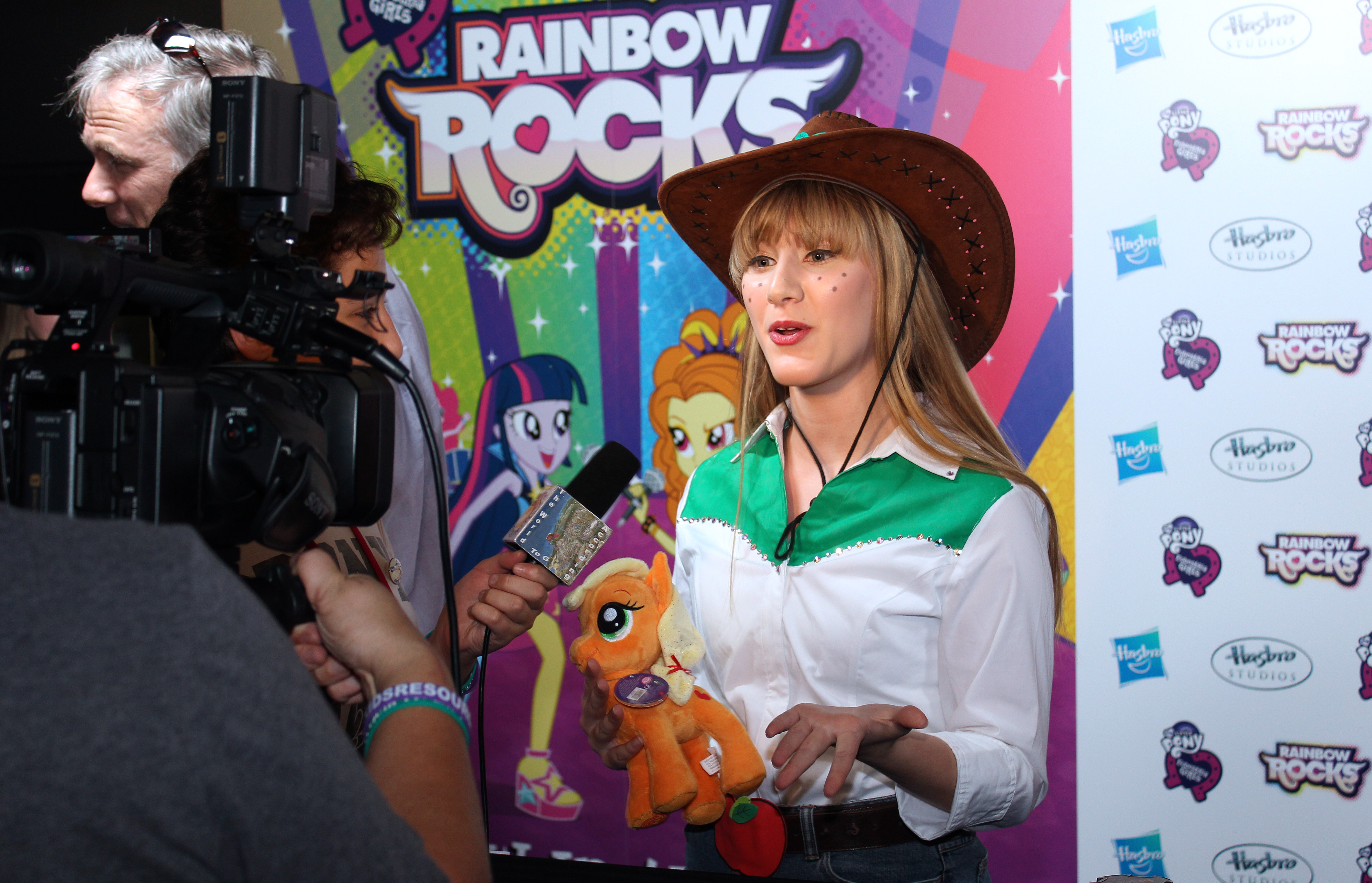 Tara-Nicole doing an interview on the red carpet at the My Little Pony: Rainbow Rocks Premiere.