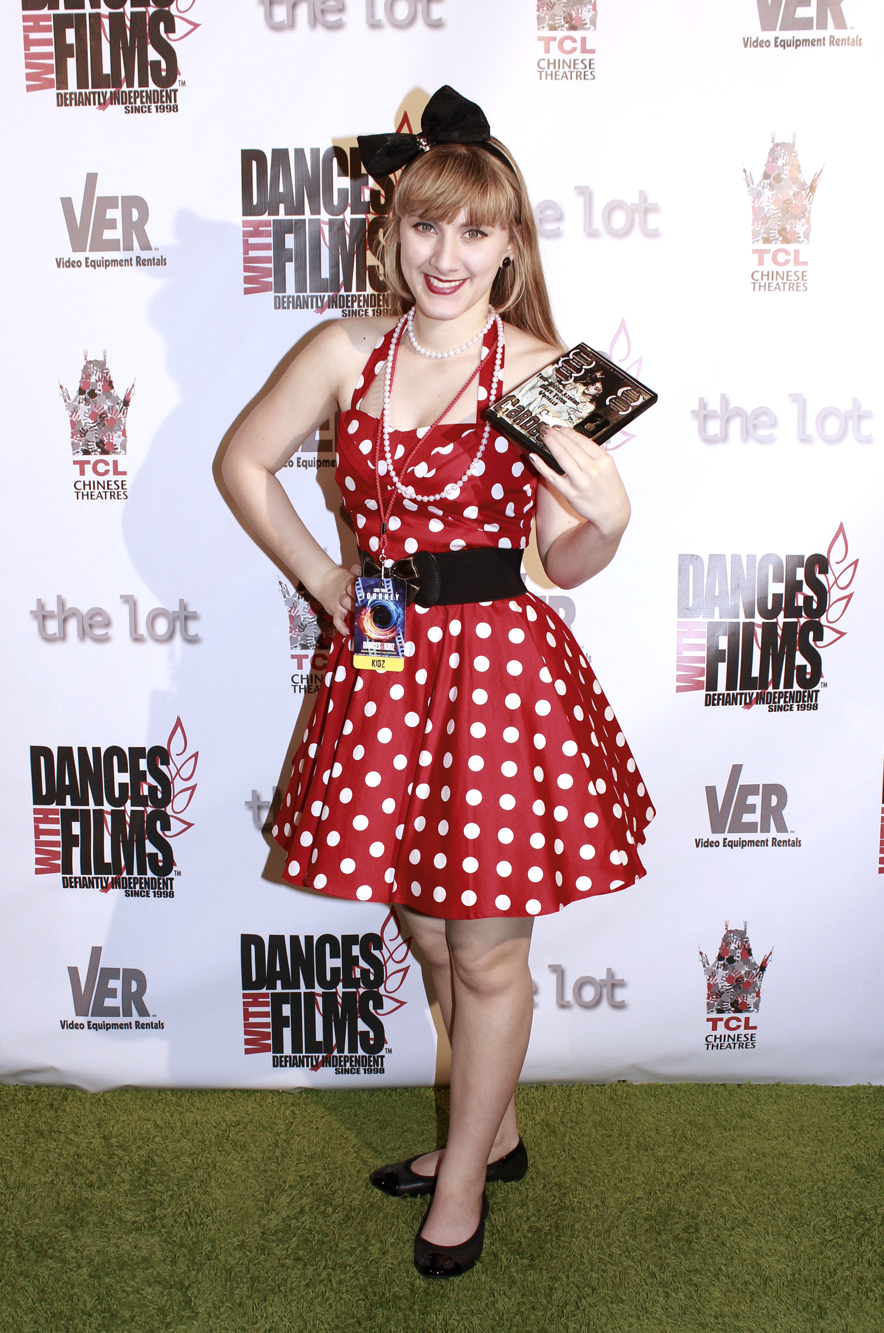 Tara-Nicole Azarian poses on the green carpet with her film 