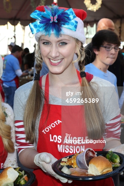 Tara-Nicole Azarian helps serve Christmas dinner to the homeless at the LA Mission 2013