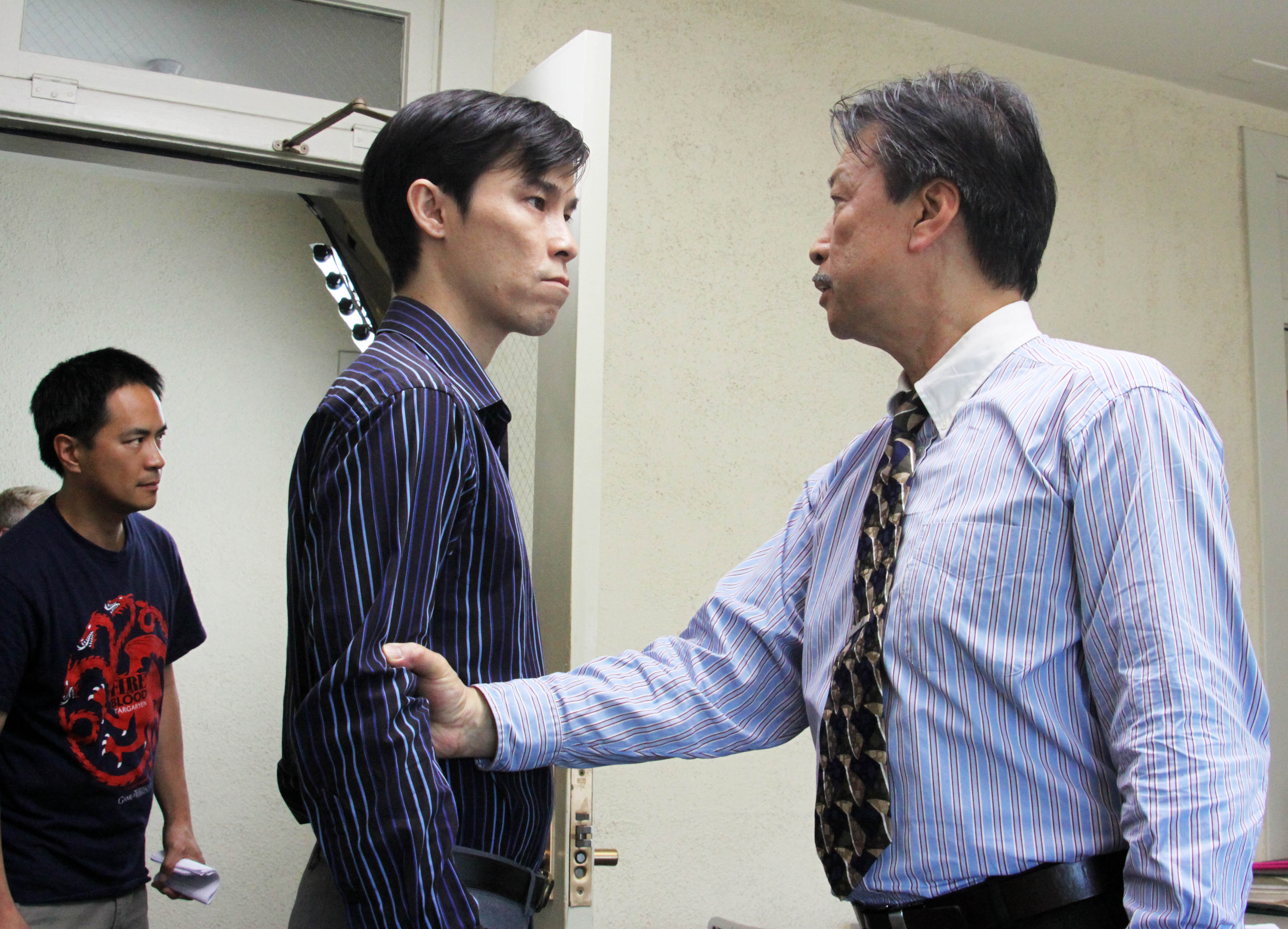 Producer/Director Stanley Yung on the set of CHINK with Jason Tobin and Tzi Ma