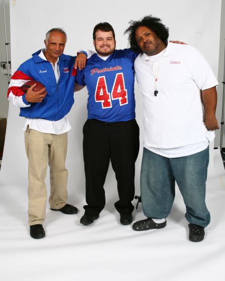 Robert Miano, Brad Leo Lyon, Bone Crusher preparing to take promotional photos for the feature film Minor League: A Football Story.