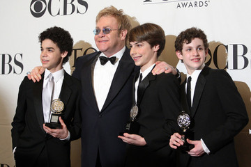 David Alvarez, Sir Elton John, Kiril Kulish, and Trent Kowalik after receiving the Tony for best actor in a musical.
