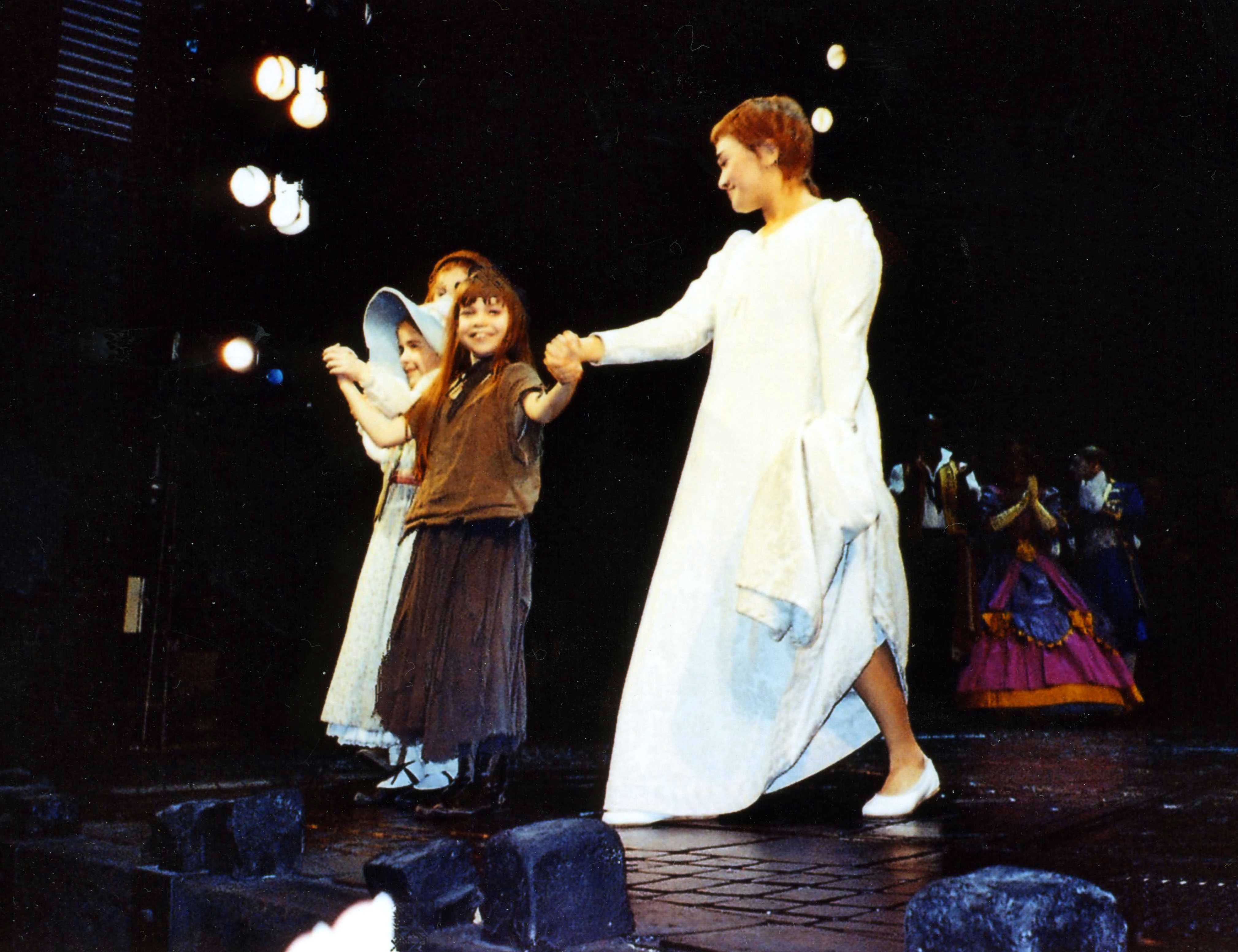 Adrianna Bertola as Young Cosette in 'Les Miserables' at The Queens Theatre, London, West End.