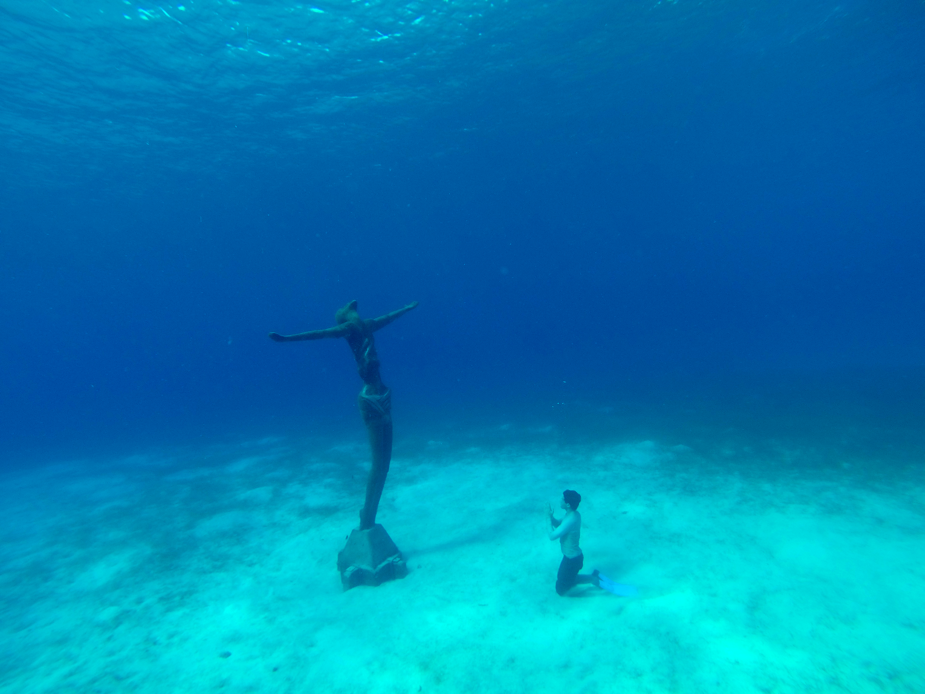 Chris Tardieu with the 'Christ the Redeemer' statue at the bottom of Chankanaab, Qintana Roo, Mexico...