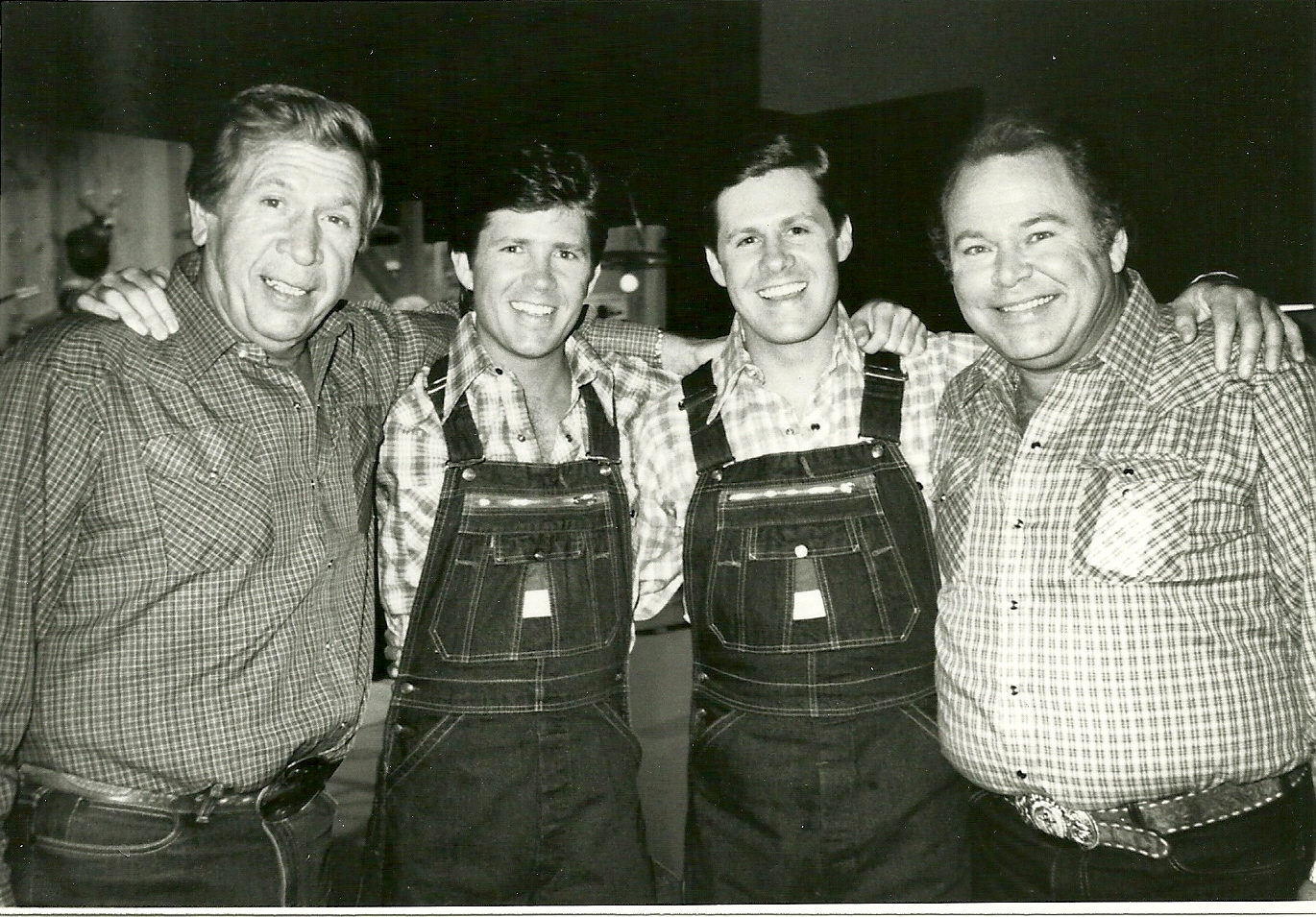Buck Owens, Butch McCain, Ben McCain and Roy Clark on the set of Hee Haw in Nashville. The McCain Brothers saluted their hometown, Bovina, Texas.